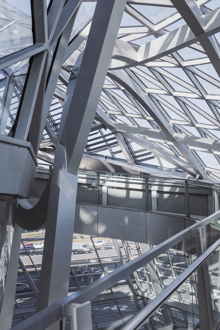 Intricate glass and steel structure showcasing modern architectural design.